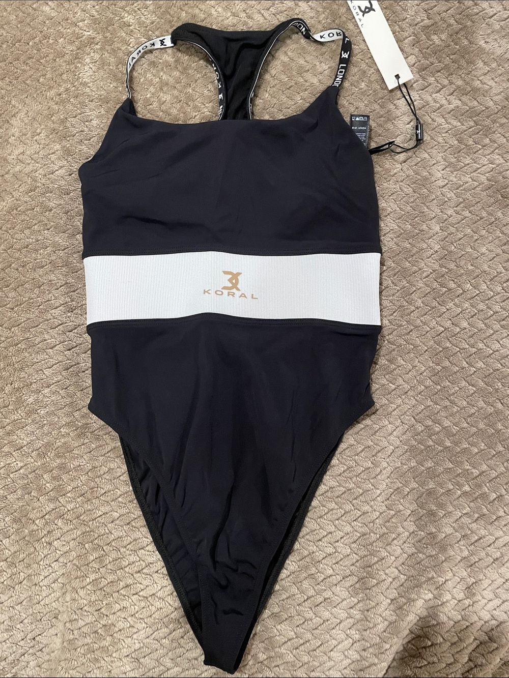 Koral Black One-Piece with White Waistband and Gold Logo